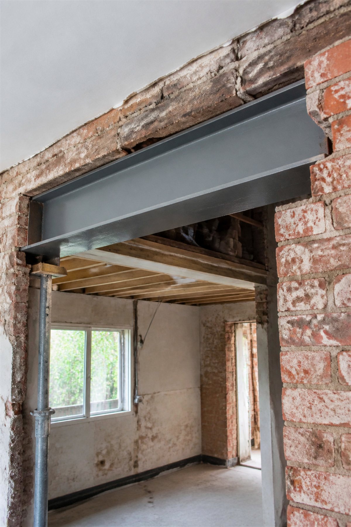 Steel RSJ I-beam installed in a brick wall opening